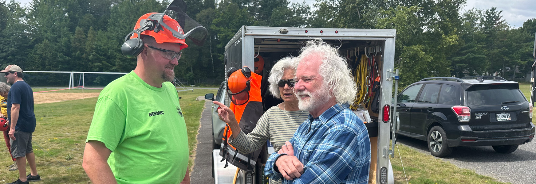 MEMIC Forest Operations Safety Consultant Barrett Parks (left) discusses tree felling safety techniques with Chuck Leavell at the Game of Logging event in Greenville, Maine, Aug. 12, 2023. 