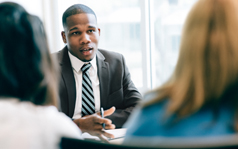 lawyer talking to clients