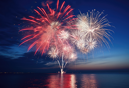 July 4 Fireworks Celebration over calm lake