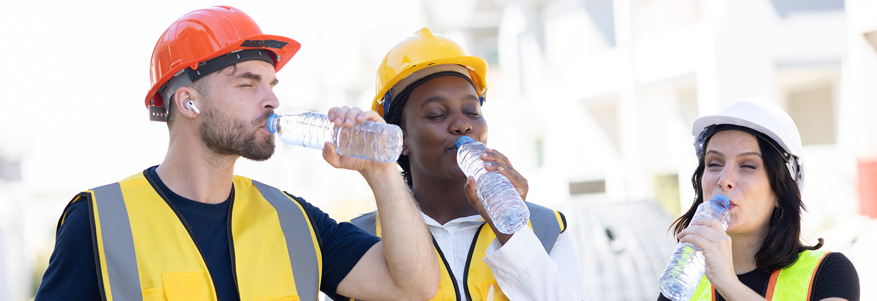 Workers in hot sun drinking cold water