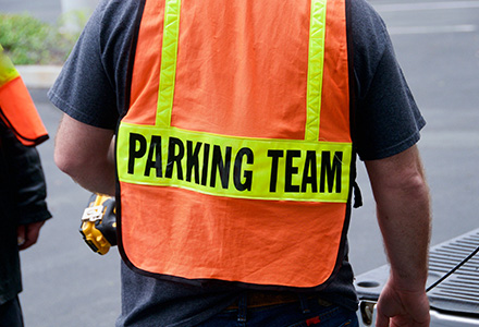Parking worker wearing high viz vest