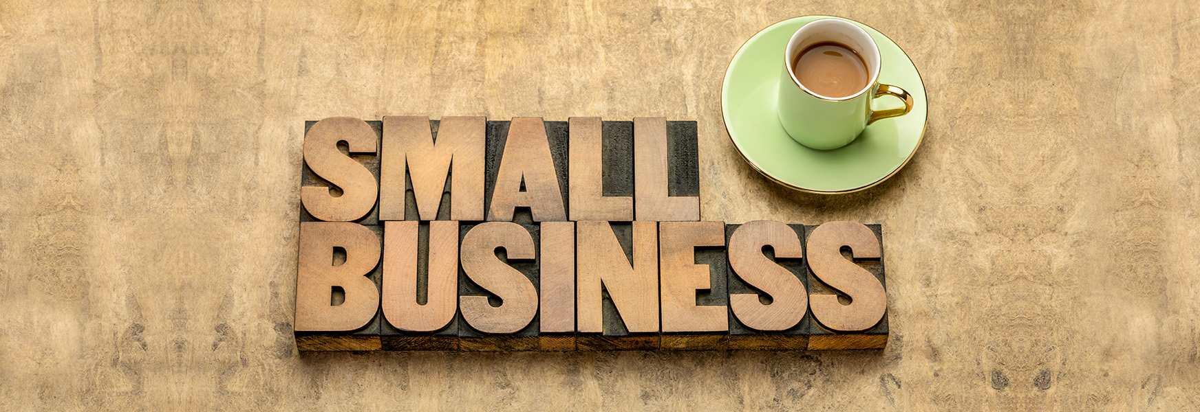 Wooden blocks spelling out 'Small Business' on a wooden table