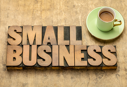 Wooden blocks spelling out 'Small Business' on a wooden table