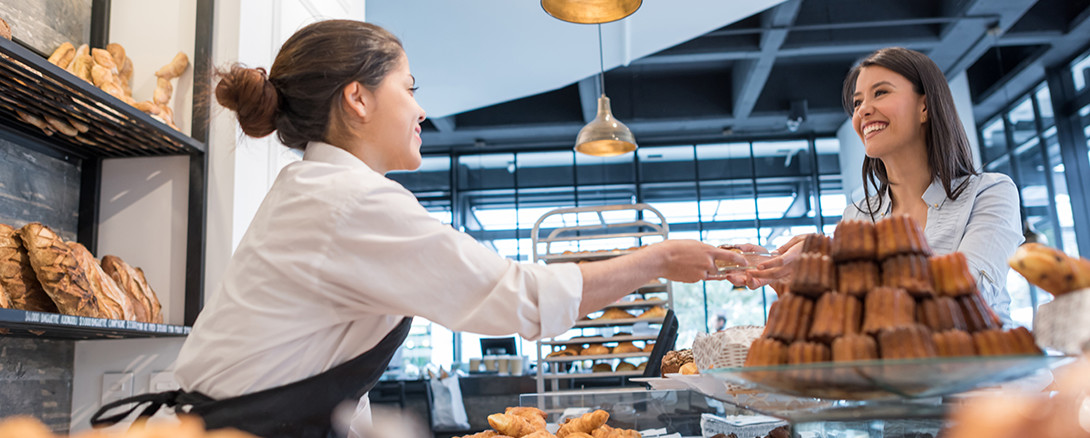 bakery worker helping customer