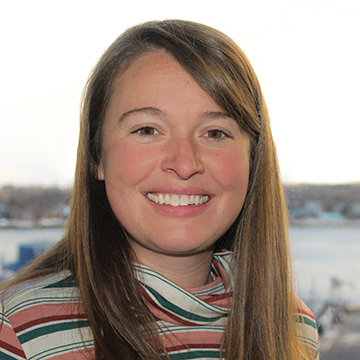 Headshot of Anna Hooper with Portland Harbor in background.